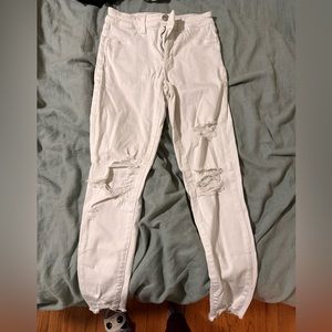 Distressed white jeans. Distressed cuffs